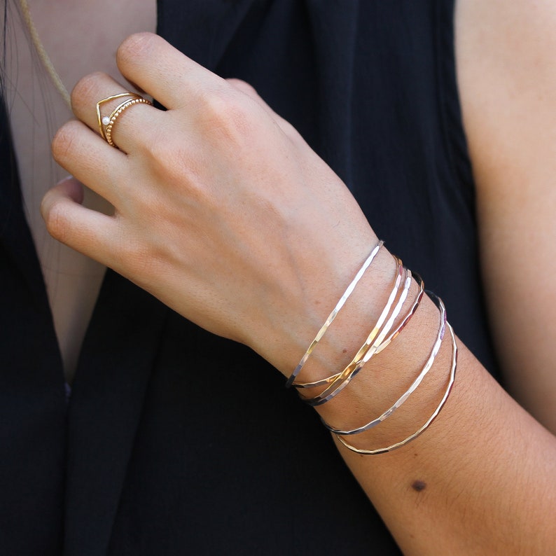 3 Thin Hammered Cuffs, Yellow Gold Bangles, handmade stacking bracelets in gold fill by Lotus Stone jewelry. Great gift for her anniversary.