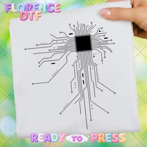 May include: White fabric with a black circuit board design. The words "FLORENCE DTF" are at the top, and "READY TO PRESS" is at the bottom. The fabric is held by a hand.