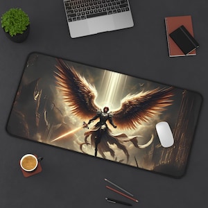 May include: A black and gold gaming mouse pad with a fantasy illustration of an angel with large wings. The angel is holding a sword and is wearing armor. The mouse pad is designed for use with a computer mouse.