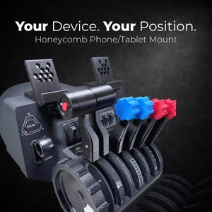 May include: A black Honeycomb phone/tablet mount with the text "Your Device. Your Position." The mount features a gear lever, switches, and levers with blue and red knobs. The mount is designed for flight simulation.