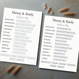 May include: Two printable crossword puzzles with the words "Danny & Emily" and "Our Love Story" at the top. The puzzles are filled with wedding-related words like "honeymoon", "togetherness", "forevermore", "bridesmaid", "bouquet", "happiness", "celebration", "ceremony", "wedding", "newlyweds", "lifetime", "ever after", and "starts from today".