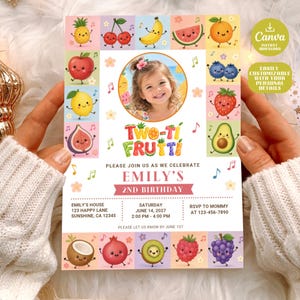 May include: A rectangular birthday invitation card featuring a central circular photo of a child surrounded by colorful cartoon fruit characters. The text reads Two-ti Frutti, Emily's 2nd Birthday, June 14, 2027, at Emily's House, 123 Happy Lane, Sunshine, CA 12345.