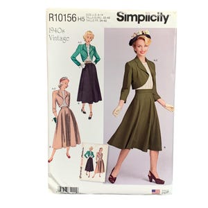 May include: Vintage Simplicity sewing pattern from the 1940s. The pattern features illustrations of women's outfits, including a skirt suit and a dress with a bolero jacket. The cover is white with text and illustrations in various colors.