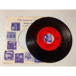 May include: A black vinyl record with a red and white label. The label features the text "Columbia", "The Union Gap", "I'm Losing You", and "Johnny Ruffin Top Ten".