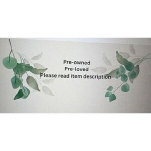 May include: A pale background with green and grey leaf illustrations. The text reads "Pre-owned, Pre-loved, Please read item description."