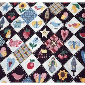 May include: A patchwork fabric featuring a repeating pattern of squares with various country-themed illustrations. The squares contain images of butterflies, birds, hearts, fruit, and houses, all outlined in black with white stitching.
