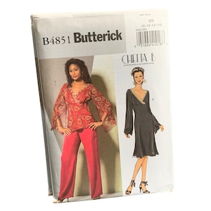 May include: A Butterick sewing pattern, B4851, featuring a red paisley top and pants ensemble, and a black dress with gold trim. The pattern includes the text "CHETTA B" and size information.