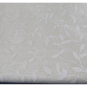 May include: White fabric with a subtle embossed pattern of white leaves and vines. The fabric has a slightly textured surface.