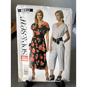 May include: A sewing pattern titled "B6312" from See & Sew. The pattern features two women modeling outfits: a black floral dress and a white patterned jumpsuit. The pattern includes the text "YES! It's easy."
