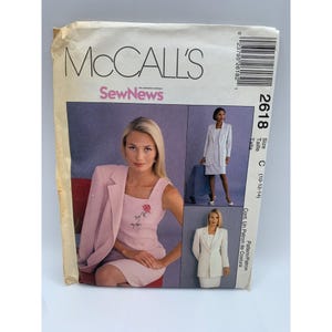 May include: A vintage McCall's sewing pattern featuring a woman in a pink suit and dress. The pattern includes images of the finished garments and the number 2618. The pattern is for sizes C (10-12-14).