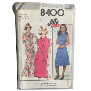 May include: Vintage Simplicity 8400 sewing pattern. The pattern envelope features illustrations of three different dresses. The envelope is white with the text "Simplicity 8400" and "Jiffy Plus". The pattern is sized for stretch knits.