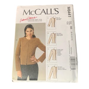 May include: A McCall's sewing pattern envelope, M6441, featuring a woman wearing a tan jacket. The envelope includes illustrations of different sleeve styles and the text "FASHION THAT FITS". Size BB (8-10-12-14).