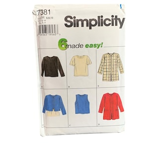 May include: A Simplicity sewing pattern packet featuring six different garment designs. The packet includes illustrations of a long-sleeved shirt, a t-shirt, a jacket, a cardigan, a tank top, and a red jacket. The packet is white with black text and a green accent.