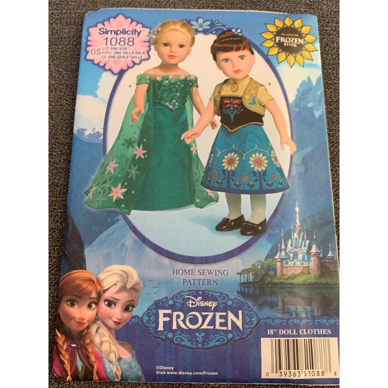 May include: Simplicity sewing pattern 1088 for 18 inch dolls. The pattern includes instructions for making two Frozen-themed outfits: a green dress with a cape and a blue dress with a vest. The pattern cover features a photo of the two dolls wearing the outfits.