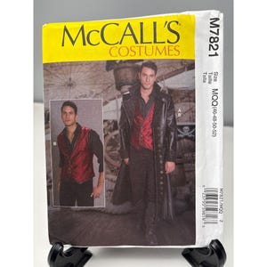 May include: A McCall's Costumes sewing pattern, M7821, featuring a man in a long black coat and red vest. The pattern includes a smaller image of the vest. The package is white with yellow and black text.