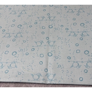 May include: Light blue fabric with a repeating pattern of birds perched on lines and scattered circles in a darker shade of blue. The fabric has a slightly textured appearance.