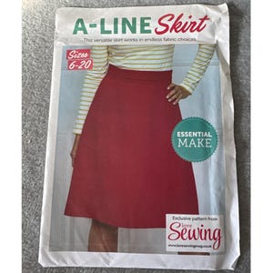 Könnte beinhalten: Schnittmuster für einen A-Linien-Rock, mit einem roten Rock auf dem Cover. Das Muster ist für die Größen 6-20 und stammt aus dem Love Sewing Magazin. Das Cover enthält auch den Text "Essential Make."