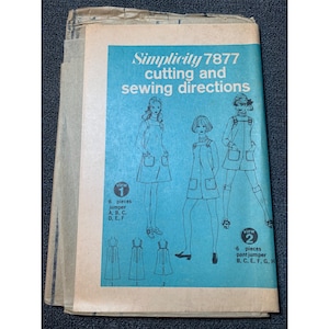 May include: A vintage Simplicity sewing pattern for a jumper or pant jumper. The pattern is for size 7877 and includes cutting and sewing directions. The pattern shows three women wearing the garment in different styles.