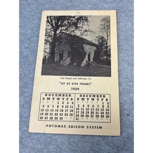 May include: A vintage calendar from 1939 featuring a black and white image of the Old Chapel near Millwood, Virginia. The calendar includes the months of November and December, with the text "LET US GIVE THANKS" above the dates. The Potomac Edison System is printed at the bottom.