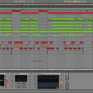 May include: A computer screen displaying a digital audio workstation (DAW) with a multi-track timeline. The timeline shows various audio and MIDI tracks with different colors and labels. The DAW interface includes a mixer, a piano roll, and other features for music production.