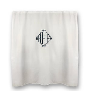 May include: White shower curtain with a monogram of the letters "AHE" in a diamond shape with a bamboo design.