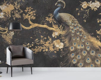 May include: A peacock with a blue head and neck sits on a branch with gold leaves and white flowers against a black background.