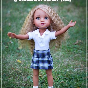 May include: A doll with long blonde hair wearing a white collared shirt and a blue and green plaid skirt. The doll is standing in a grassy field with her arms outstretched. The text "May you have a BLESSED & successful school year!" is at the top of the image. The text "Grace Filled Hands" is at the bottom of the image.