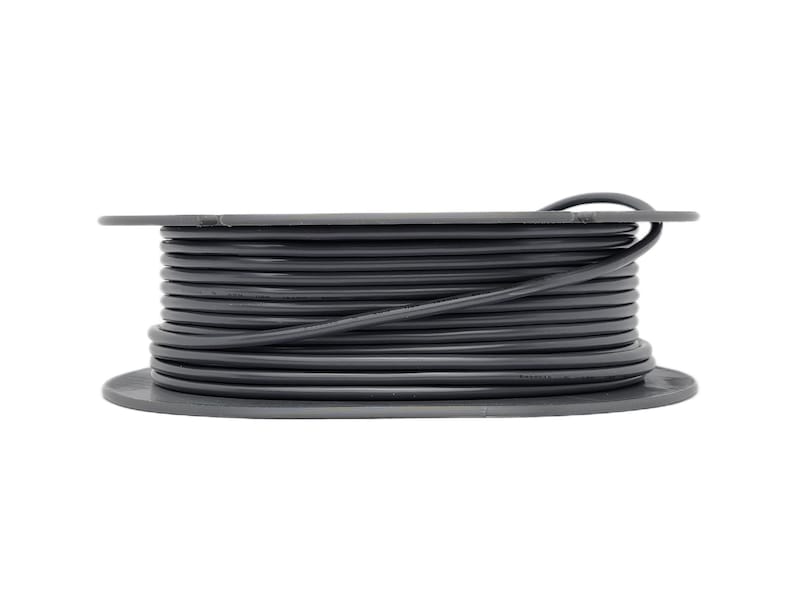 Side profile of Starlink Mini cable organizer holding a neatly wound cord