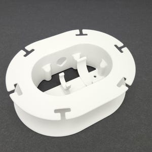 Empty white Starlink Mini cable organizer spool