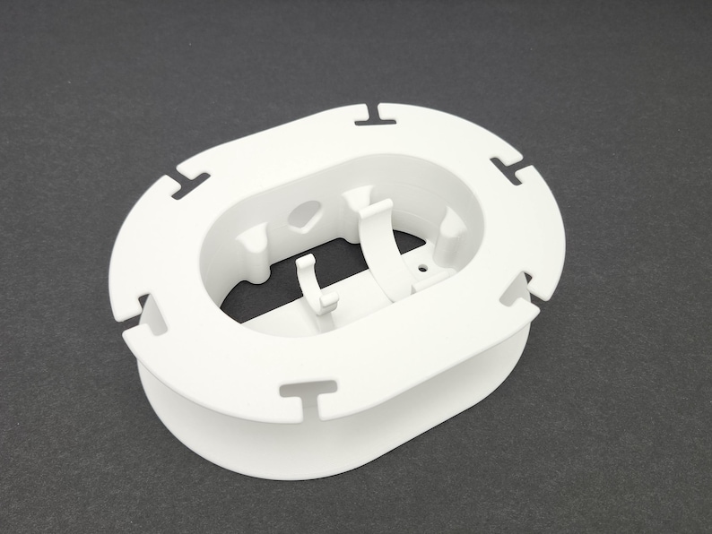 Empty white Starlink Mini cable organizer spool