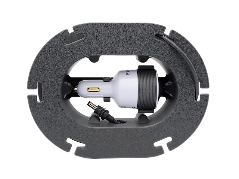 Top view of Starlink Mini cable winder showing integrated connector storage