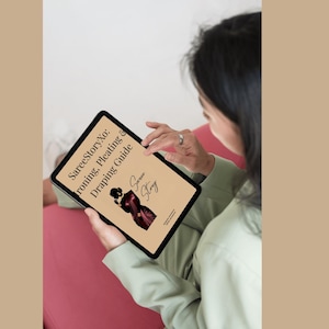 May include: A tablet showing a guide titled "SareeStoryXo: Ironing, Pleating & Draping Guide." The cover has an illustration of a woman in a saree. The tablet is held by a person wearing a light green jacket.