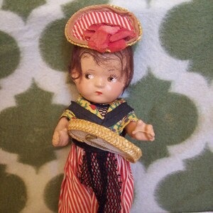 Antique Composition doll with Traditional costume.  Maybe 1930s. Probably Bavarian Dress.
