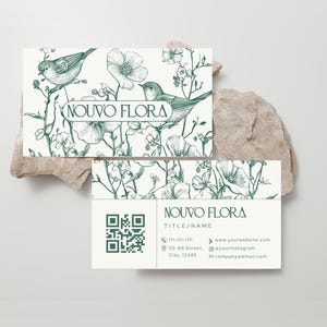 May include: Two business cards with a floral and bird design in green and white. The top card features the text "NOUVO FLORA" and a drawing of birds and flowers. The bottom card includes a QR code and contact information.