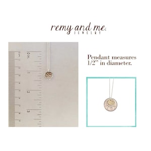 May include: A silver necklace with a small, textured gold pendant. The pendant is circular and measures 1/2 inch in diameter. The text "remy and me" is at the top of the image.