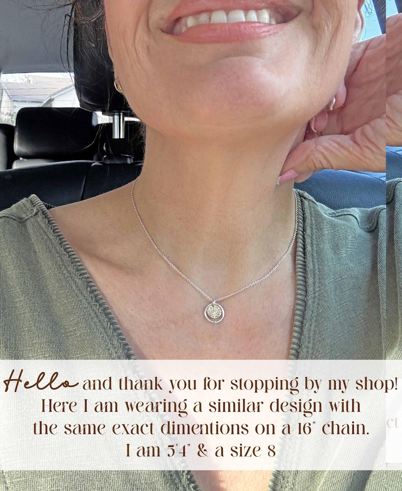 May include: A silver necklace with a small, circular pendant. The pendant has a detailed design within a circular frame. The necklace is worn on a person. The image includes the text: "Hello and thank you for stopping by my shop! Here I am wearing a similar design with the same exact dimentions on a 16" chain."