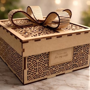 May include: A laser-cut wooden gift box with a decorative bow on top. The box features intricate geometric patterns and a small rectangular label that reads "Treasure chest for my wife."