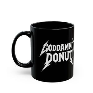 Black ceramic mug with bold white text in a Metallica-style font that reads “Goddamnit Donut,” inspired by Dungeon Crawler Carl. The mug is set on a modern kitchen counter, perfect for fans of LitRPG, Princess Donut, and Matt Dinniman's cult book series. Ideal for coffee or tea lovers who enjoy a mix of humor, chaos, and fandom in their daily routine.