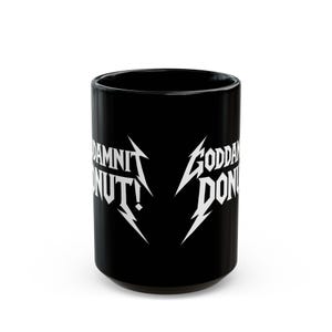 Black ceramic mug with bold white text in a Metallica-style font that reads “Goddamnit Donut,” inspired by Dungeon Crawler Carl. The mug is set on a modern kitchen counter, perfect for fans of LitRPG, Princess Donut, and Matt Dinniman's cult book series. Ideal for coffee or tea lovers who enjoy a mix of humor, chaos, and fandom in their daily routine.
