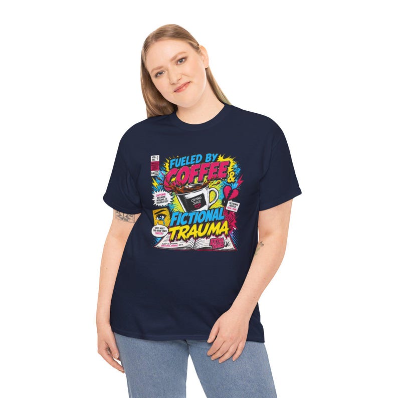 Woman wearing navy blue Fueled by Coffee and Fictional Trauma bookish graphic tee, colorful comic print, book lover gift, BookTok shirt