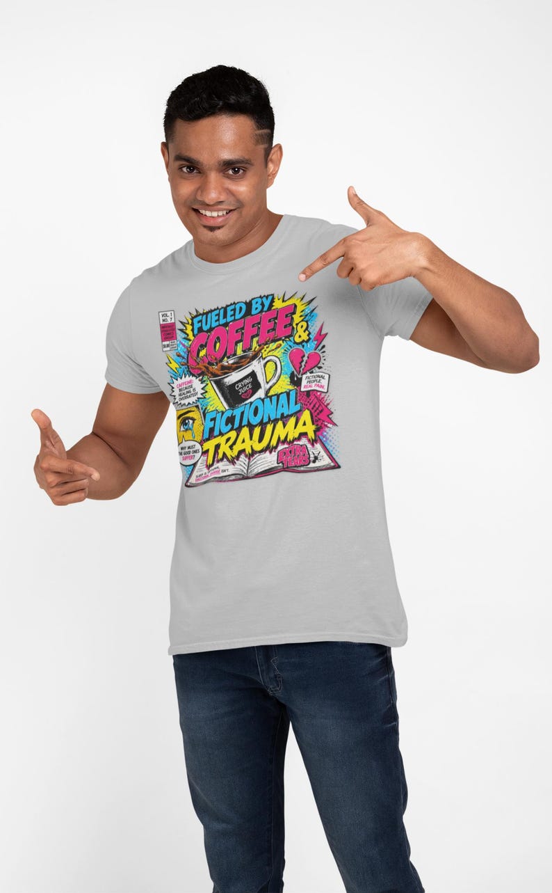 Man in light grey tee pointing at Fueled by Coffee and Fictional Trauma graphic, white background, bookish gift for readers