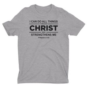 May include: Gray t-shirt with black text that reads "I can do all things through Christ who strengthens me Philippians 4:13"