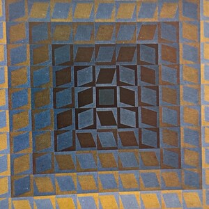May include: Abstract geometric artwork featuring a square design with a repeating pattern of diamonds and squares. The color palette includes shades of blue, brown, and gold, creating a visually dynamic and textured effect. The artwork has a vintage aesthetic.