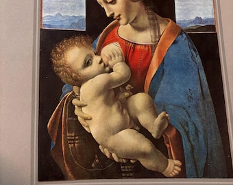 May include: A Renaissance-style painting depicts a woman in a red and blue robe holding a baby. The baby is fair-skinned with curly hair. The woman has a serene expression. The background features arched windows with a landscape view.