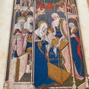 May include: A medieval-style illustration depicting the Nativity scene. The image features a central figure of a baby Jesus, surrounded by Mary, Joseph, and angels. The scene is set within a gothic-style architectural framework, with a vaulted ceiling and stained glass windows. The image is painted in a vibrant palette of gold, blue, red, and green.