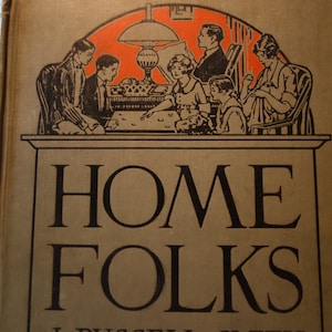 May include: A vintage book cover with the title "HOME FOLKS" in large, bold, black letters on a brown background. The cover features a black and white illustration of a family gathered around a table with a lamp.