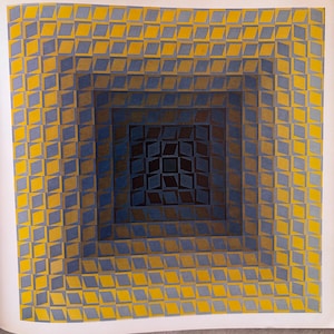 May include: Abstract geometric artwork featuring a square design with concentric layers of diamonds. The diamonds transition from yellow to blue and brown, creating a 3D effect. The artwork is on a white background.