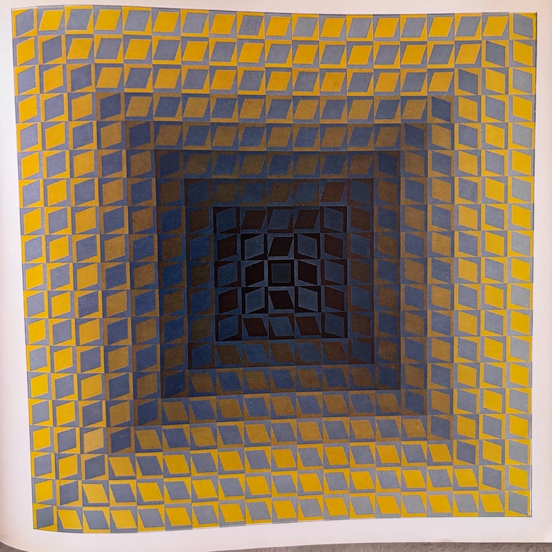 May include: Abstract geometric artwork featuring a square design with concentric layers of diamonds. The diamonds transition from yellow to blue and brown, creating a 3D effect. The artwork is on a white background.