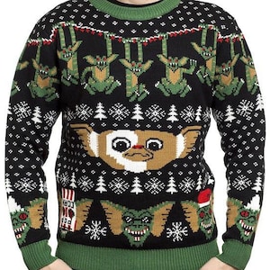 May include: Black Christmas sweater with a green, white, and red pattern. The sweater features a graphic of the character 'Gizmo' from the movie 'Gremlins'.