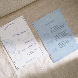 May include: Two blue and white invitation cards for a bachelorette weekend. The first card says "Please join us in honor of Olmas Denim Diamonds Bachelorette Weekend June 6th June 8th, 2023 123 Anywhere Street Nashville, TN". The second card says "Olmas Bachelorette Weekend Itinerary Friday Saturday Sunday".